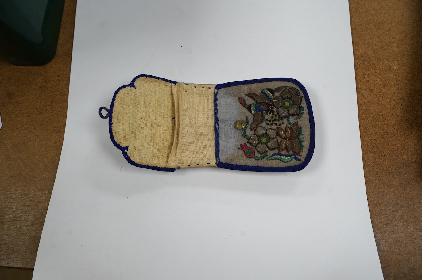 An Asian embroidered and metal thread purse, possibly Tibetan, 12 x 8cm. Condition - fair to good